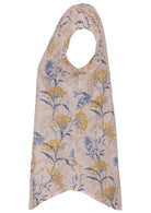Side view of neutral based floral print cotton top with cap sleeves.