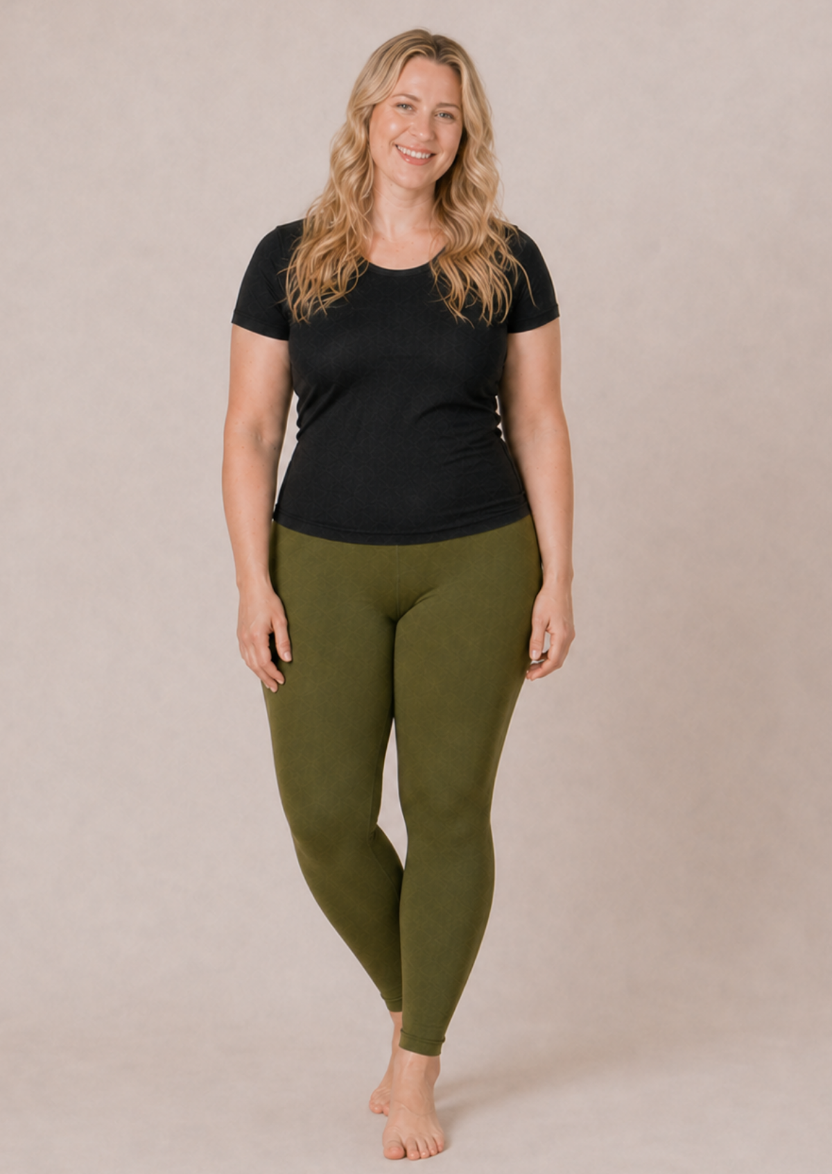 Plus size model wearing olive leggings