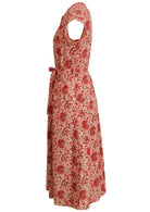 Side view of 50's style cotton button through midi length dress with a waist tie and hidden side pockets