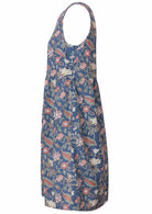 Side view of above knee length sleeveless cotton dress with hidden side pockets in dusty blue based sweet floral print 