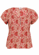 Cream based floral print 100% cotton top with coconut buttons.