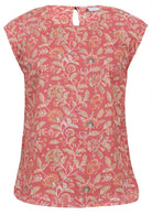 Cotton sleeveless top with a muted floral print with a dusky pink base