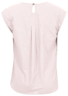 Back view of white cotton sleeveless top with button closure at the nape of neck and central pleat in the back