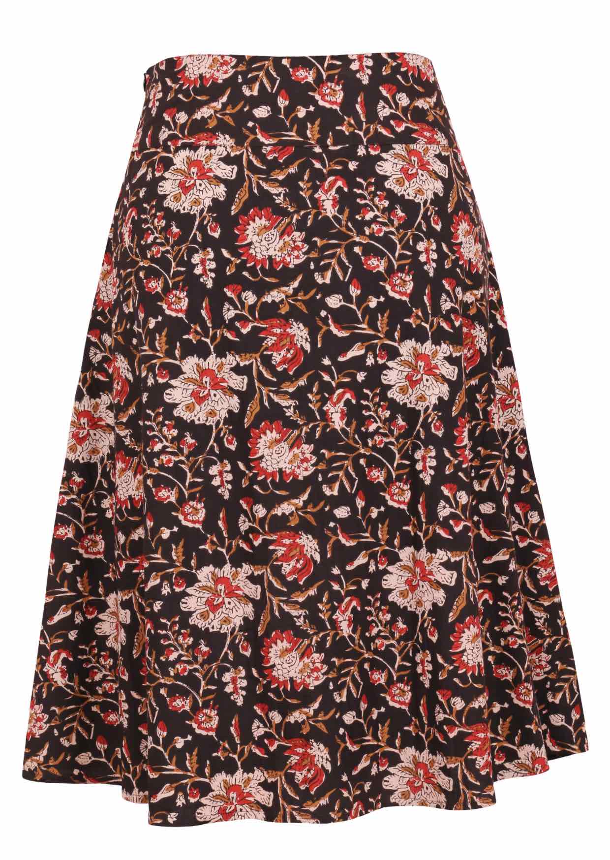 Black based traditional Indian floral print cotton skirt on a white background.