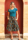 Model wears cotton skirt with hidden side zip and pockets