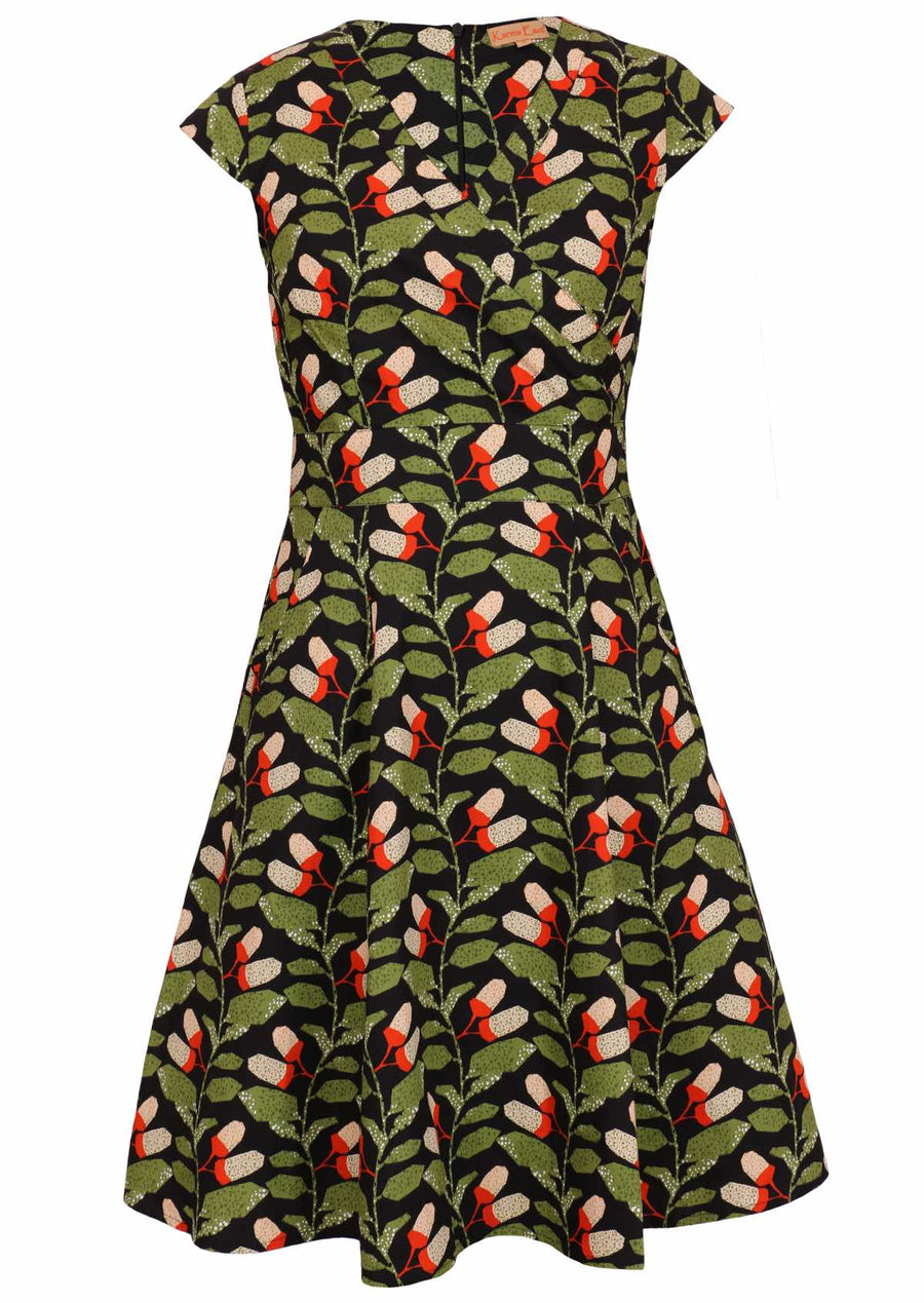 Plus size model wearing retro style cotton Alice dress in black and green 