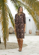 Woman in floral knee length sundress with sleeves, 100% cotton with pocket