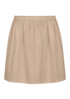 Nude toned slight A-line cotton slip skirt with elasticated waist and picot trim on hem, front view