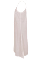 White cotton voile slip dress with adjustable spaghetti straps, V-neckline, side splits and a picot trim hem, side view
