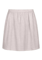 White slight A-line cotton slip skirt with elasticated waist and picot trim on hem, back view