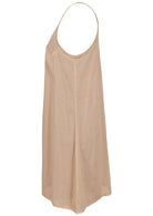 Beige cotton slip with halter neck and lace hem, side view