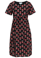 Front view of cotton dress with round neckline in black based floral print
