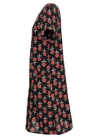 Side view of cotton dress with round neckline and short sleeves in black based floral print. 