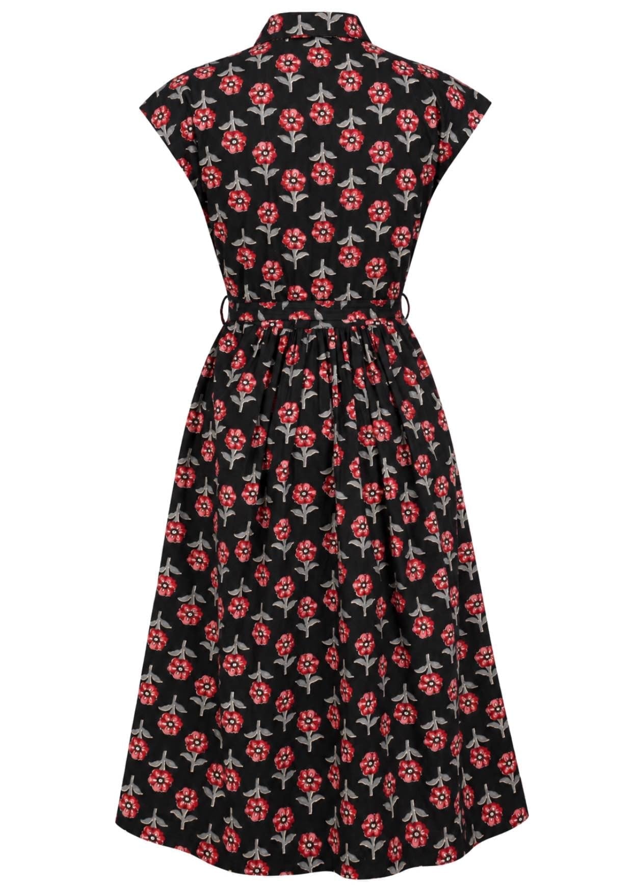 Back view of black based floral print cotton cap sleeves dress.