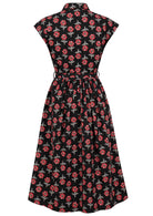 Back view of black based floral print cotton cap sleeves dress.