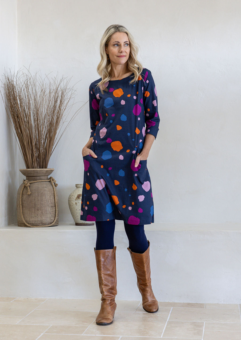 Model wearing a 100% cotton dress in bold and colourful printed dress with round neckline and 3/4 sleeves