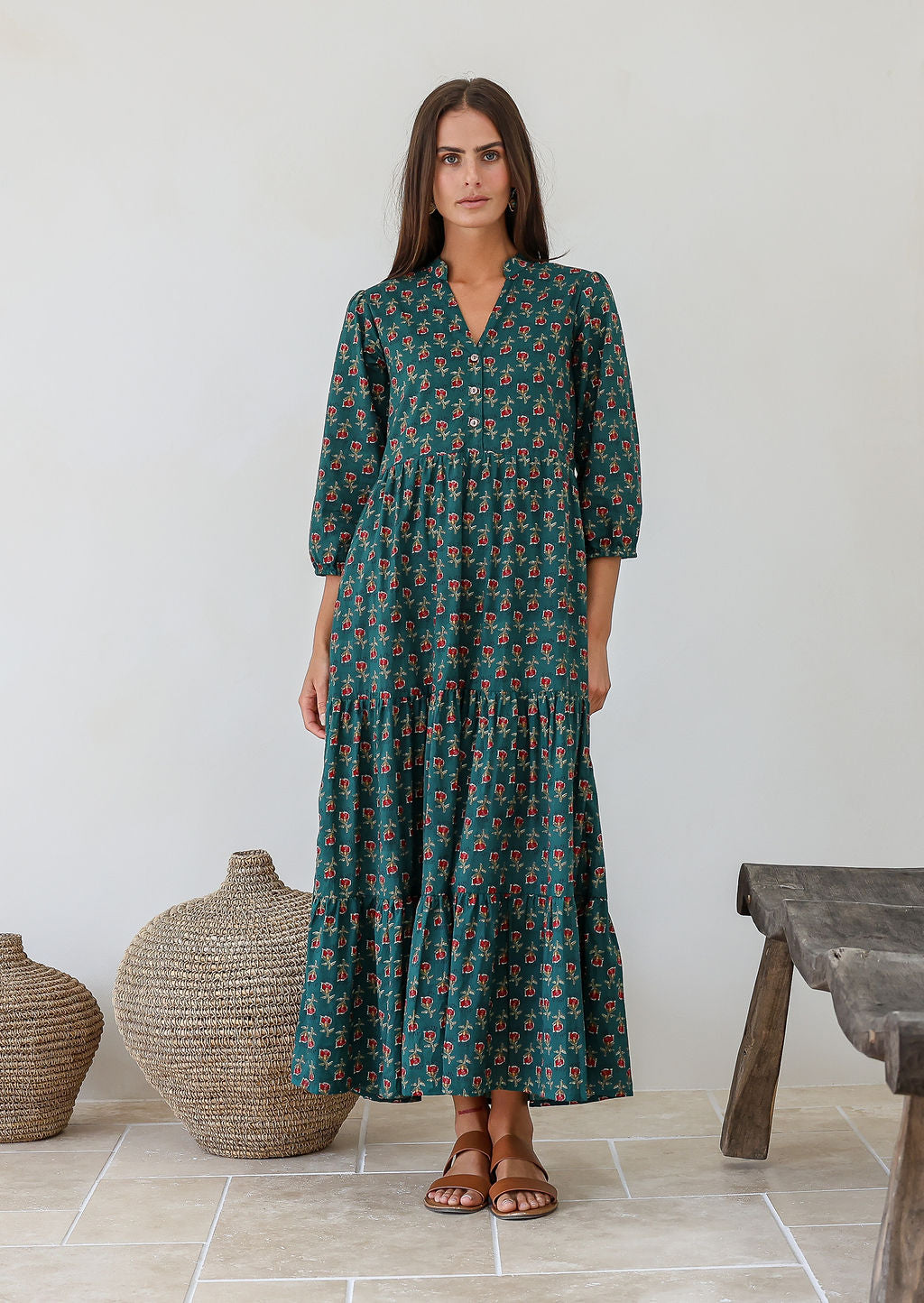 Model wearing 100% cotton flowy three tiered maxi dress with buttoned bodice, 3/4 sleeves and hidden side pockets 