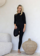 Woman wearing full length jersey fabric leggings