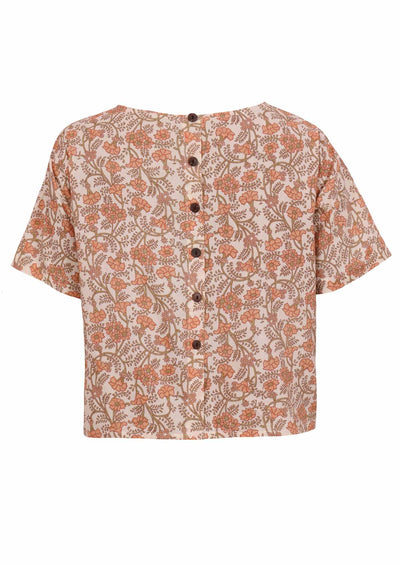 Back mannequin image of floral top with decorative buttons down centre
