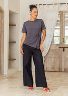 Woman wearing a Dark grey women’s twist-front T-shirt, stretch rayon short-sleeve top with subtle draped knot