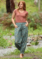 Modern Aladdin style cuffed pant with wide flat front waistband and pockets 