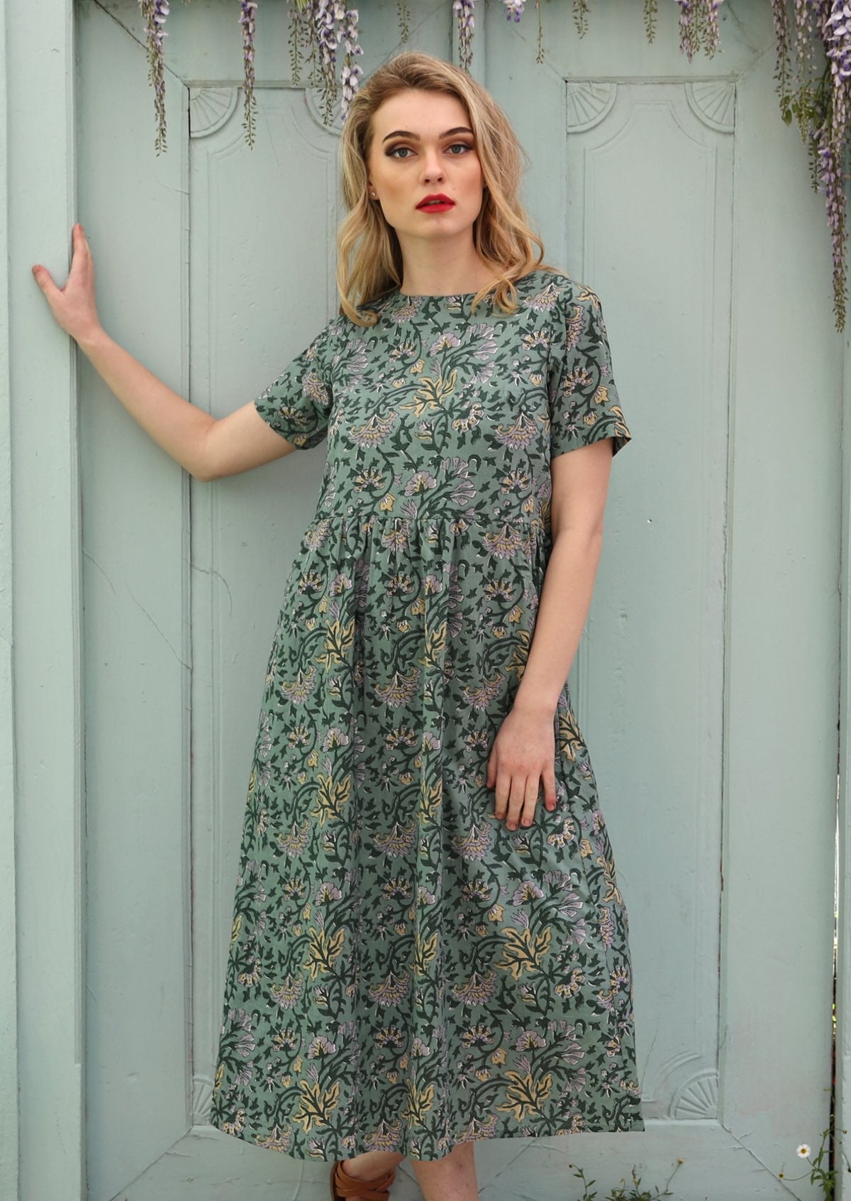 100% cotton Mid Calf Dress with short sleeves and pockets.