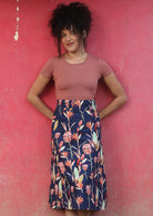 Belt Loop Skirt a-line below the knee length womens skirt with thick waistband and belt loops side zipper 100% cotton navy blue background pink and green toned native floral print | Karma East Australia