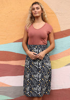 below knee length cotton skirt with striking wattle print in greys and pops of yellow