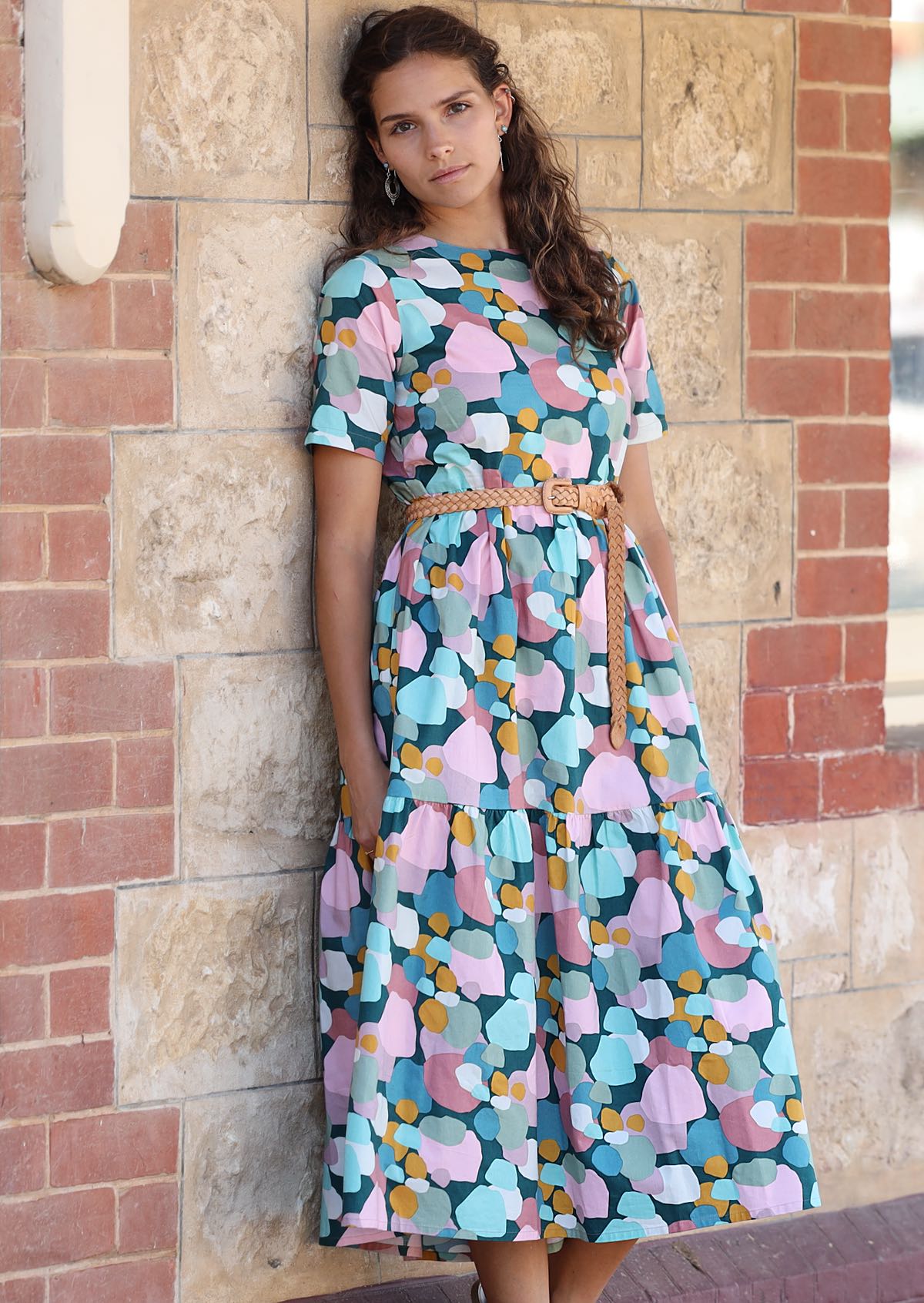 Woman wearing relaxed loose fit length sits mid calf