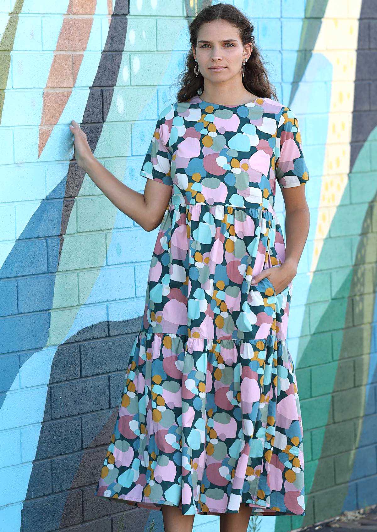 Woman wearing short sleeve women's midi dress with side pockets