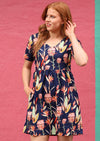 Redheaded woman in Short Sleeve Cotton Dress with hands in Pockets