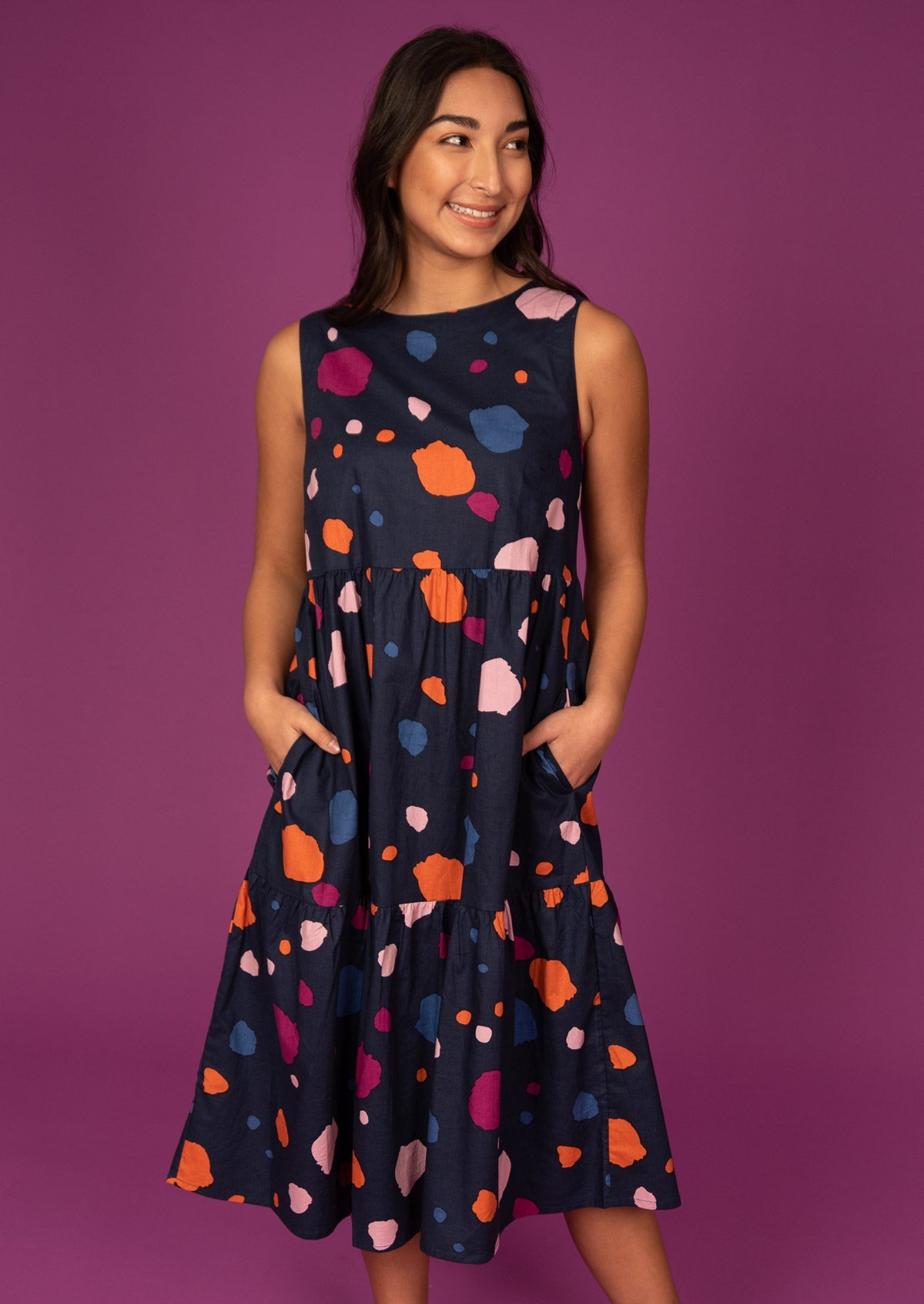 Sleeveless Midi Dress with Pockets and colourful splotches scattered over navy base.