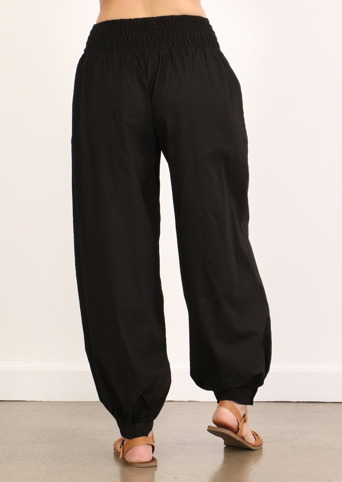 elasticated Back view of simple cotton women's pants in black with ankle cuff and pockets cotton pant Australia