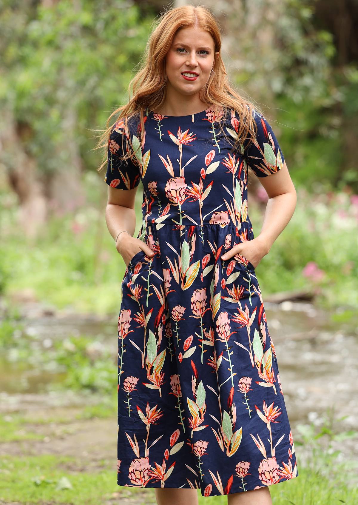 Woman wearing bold native floral print 100% Cotton Dress. 