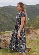 Cotton shin length dress can be cinched at the waist with fabric belt tie, or a belt