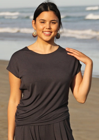 Asymmetrical Top dark grey round neckline short sleeve asymmetrical body creating elegant gathering at side soft stretch rayon fabric | Karma East Australia