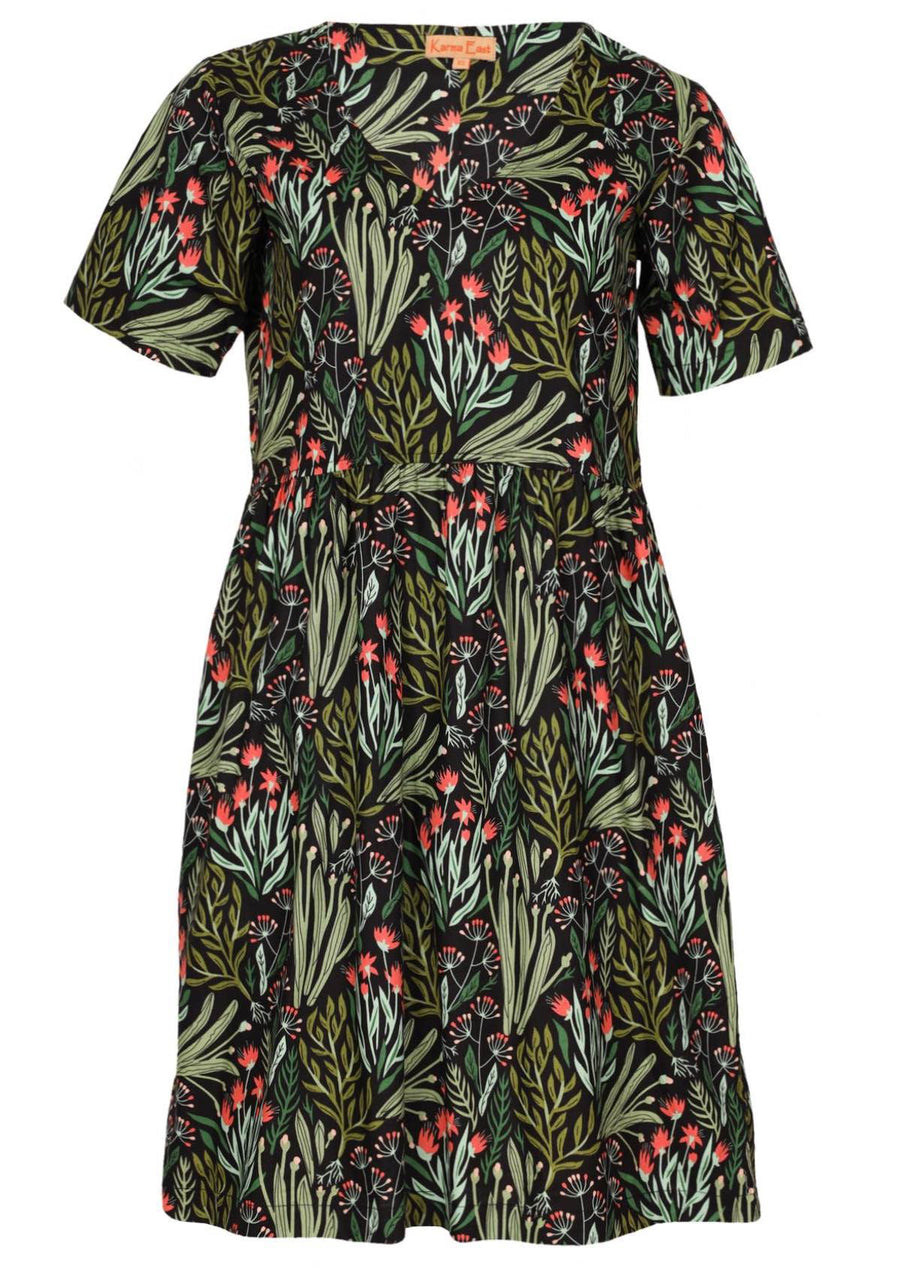 Woman in Harlow Dress Floral 100% Printed Cotton Womens Dress v-neckline short sleeve gathered waistline above knee length skirt with pockets