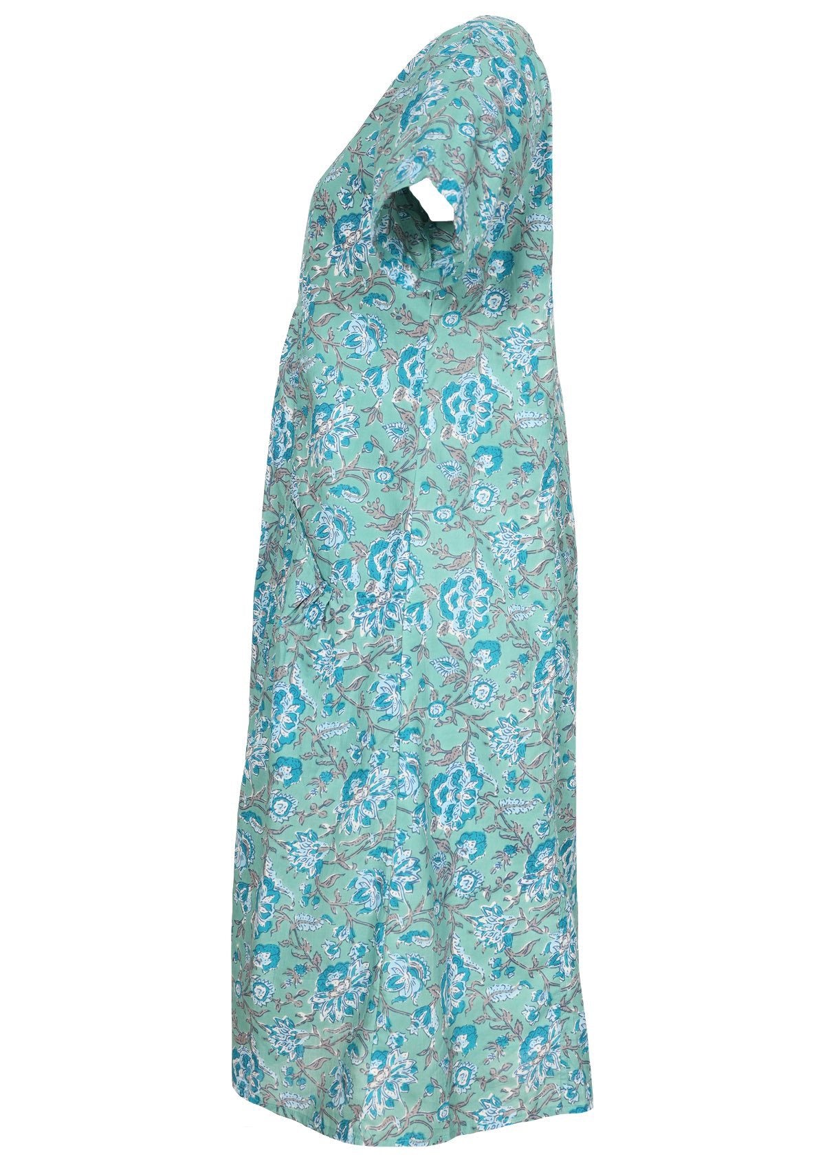 Side view of knee length cotton dress with short sleeves in indian floral print.