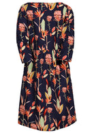 Back view of knee length cotton dress with gathers at waistband and 3/4 sleeves.